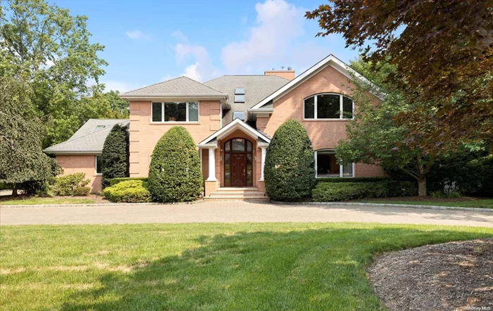 The one you have been waiting for in The Gates of Woodbury! Beautiful 6-bedroom, 6 1/2 bath brick colonial. Built in 2004, this 6000 sq ft home is located on one of the most sought after streets in the neighborhood with a perfect midblock location. Showing light and bright with soaring ceilings and walls of windows. This custom built home, with large room sizes offers a great flow for entertaining. Oversized formal dining room. Formal living room opens to billiard room with bar & dual fireplace. Two story family room flows into gourmet eat in kitchen plus 2 ensuite bedrooms & a powder room on the first floor.  Dual staircases take you to the 2nd floor featuring a master bedroom suite with walk in closets & master bath, 2 ensuite bedrooms, home office & bonus room. Spacious full walkout basement with full bath. Beautiful stone patio with built in BBQ and bar area plus lighted, private tennis court. 3 car garage. Unbelievable taxes! You don&rsquo;t want to miss this one.