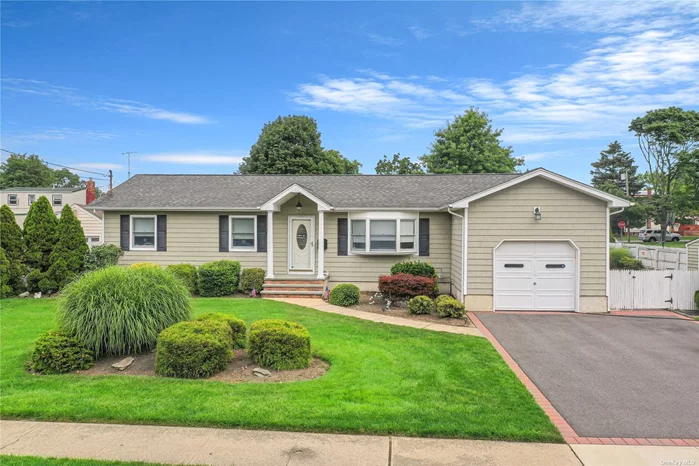 Welcome Home! This beautiful three bedroom, one and a half bath ranch is move in ready ! Complete with granite counter tops kitchen, beautiful hard wood floors. full basement and a 1 car attached garage. Huge corner lot, with backyard access. MUST SEE!