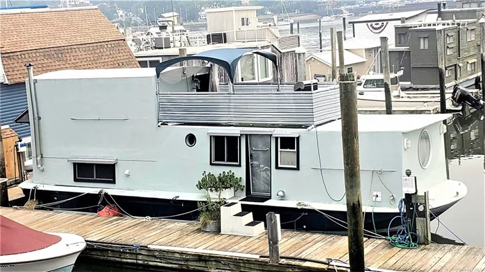 Houseboat 48&rsquo; X 14&rsquo; Chris Craft hull built on sturdy V-Hull built with traditional framing, insulation, sheeting and wrapped in fiberglass. It features one bedroom, living room, lovely kitchen, full bath and office area. It has washer/dryer, a portable A/C unit, plenty of storage space. An amazing upper deck makes it absolutely a fun place to live on the waterfront!! Sold in &rsquo;as is&rsquo; condition. Slip fee is $700/month. Cash transaction only!