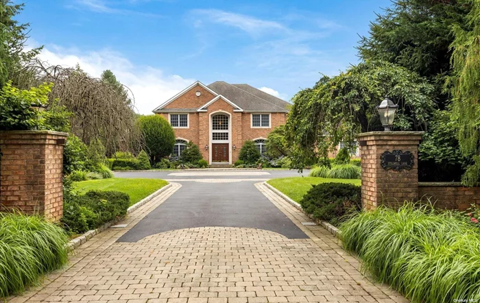 Immaculate & beautiful, 5580 square foot, 5 bedroom, 3.5 brick colonial. Built in 1998, this home boasts grand two-story entryway, hardwood floors & 9 foot ceilings. Living room opens to library with gas fireplace. Large dining room with gorgeous built in bar & buffet. Oversized, gourmet eat in kitchen with Thermador, Bosch & Sub-Zero appliances opens to family room, making this a great home for entertaining. First floor bedroom/office offers private area for guests or working from home. Master bedroom suite with room size walk in closet & master bath plus 3 additional bedrooms and 2 full baths complete the second floor. Magnificent, flat 2.5 acre property with inground, gunite, heated pool, cabana and plenty of room to play. 3 car garage. Syosset School District.