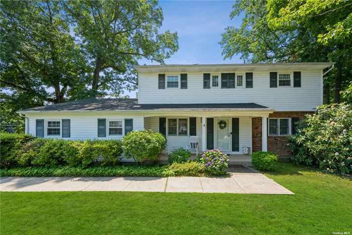 Welcome to This 4 Bedroom, 2.5 Bath Beautiful Colonial Situated on Almost Half An Acre of Sprawling Property In a Desirable Area in Glen Cove. This Bright & Sunny Home Features Beautifully Renovated Eat In Kitchen With Custom Cabinetry, Granite Countertops, Stainless Steel Appliances, and Wonderful Bay Window. Formal Dining Room with Wood Burning Fireplace, Finished with Ornate Crown Moldings and Warm Hardwood Floors . Formal Dining Room Perfect for Entertaining, and Den with Beautiful Ceramic Tiling with Walk Out Doors to Back Patio Area. First Floor Finishes Off with Ultra Convenient Washer and Dryer, and Renovated Half Bath. Second Floor Features Large Master Bedroom with En-Suite Bathroom, 3 Additional Bedrooms and Second Additional Full Bath. Hardwood Floors, Gas Heating & Cooking, New Air Conditioners, and Much More, WIth A Wonderful Large Private Fenced Yard with Serene Park Like Setting. This Is Rare Find, Must See!