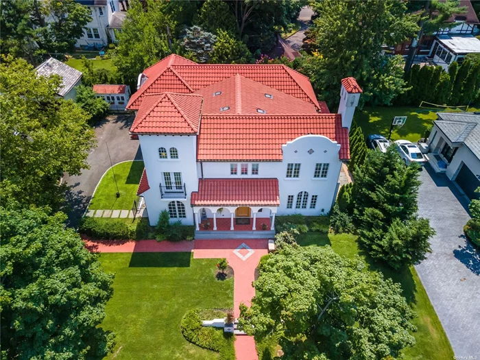 Brand new to market, this stunning & stately approx.5, 000 sq. ft Mediterranean style Colonial w/4 Bdrms, 3.5 Bths is a showplace in the heart of Kensington village. The two story center hall features an elegant bridal staircase opening to oversized Living & Dining areas w/10 ft ceilings and oversized Pella windows. The European center Island kitchen features top of the line Miele Appliances, Ceaser stone countertops, 5 burner gas stove, floor to ceiling storage and a walk in pantry. The den has a coffered ceiling and built in entertainment center. Magnificent Custom millwork and architectural details are featured throughout. The second floor has an enormous master bdrm, an impressive walk in closet and porcelain en-suite bath. There are 3 additional large bdrms and 2 more custom Bths. The lower level has a full finished walk out basement. Baker Elementary and your choice of North or South Schools. Private police & pool club. Close to LIRR, Parks, shopping. Don&rsquo;t miss this!