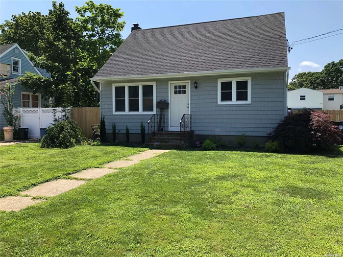 Redone in 2018 with new roof, windows, siding, hardwood floors, Kitchen and Baths, central air conditioning! Full part finished basement and large yard!