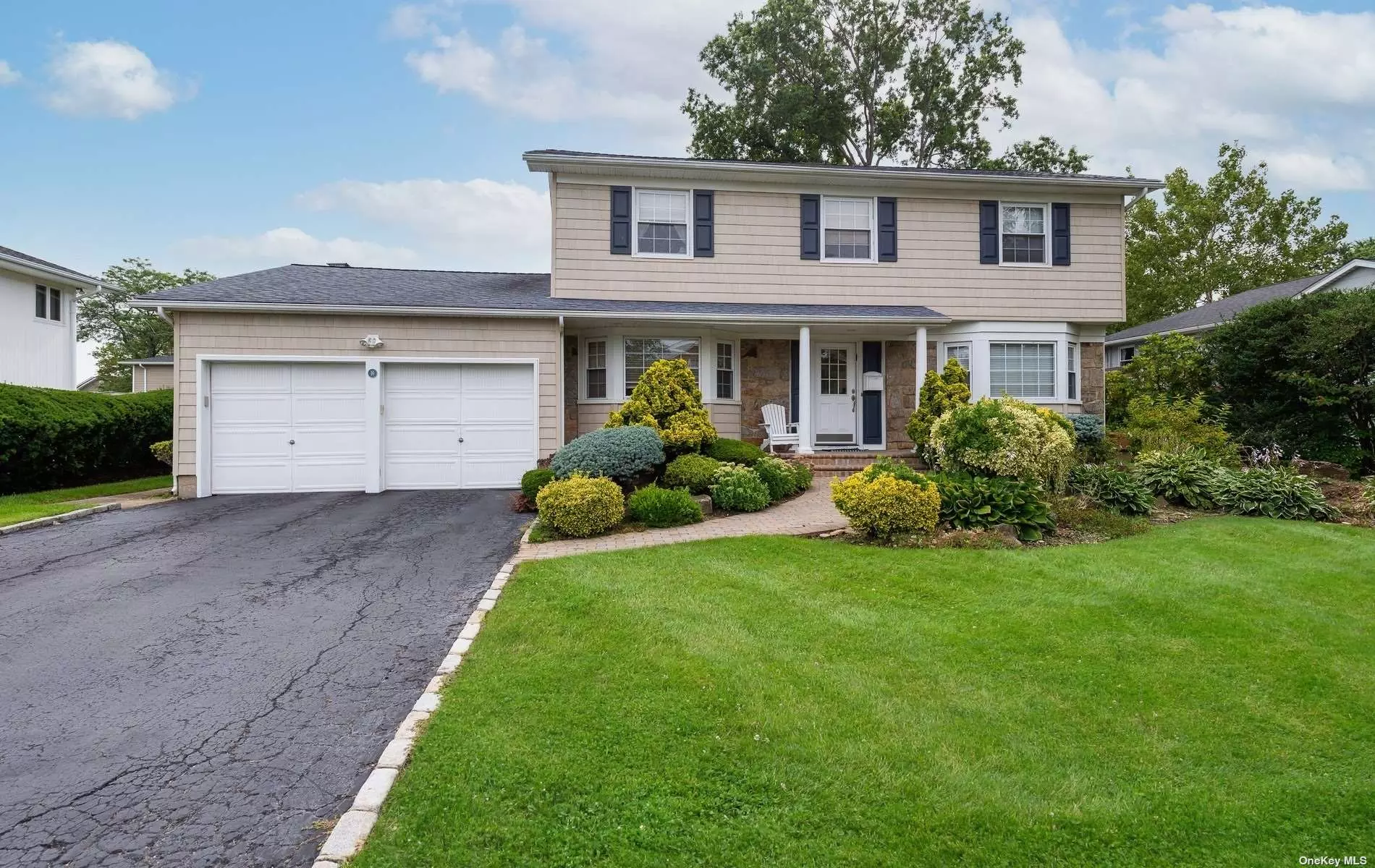 Superb Move-In-Ready Colonial located in the Jericho School District. Magnificent outdoor space. The bright and sunlit kitchen with granite countertops, quality custom wood cabinetry, and upscale appliances is the heart of this home. French doors open to the backyard with brick patio, mature lush landscaping and a gas connection to the outdoor barbecue. The den with soaring ceiling flows from the kitchen. The formal dining room and spacious living room are elegant spaces for entertaining family and friends. Upstairs there are 4 Bedrooms and 2 full baths. The Main bedroom suite with vaulted ceiling and decorative wood beams offers a deluxe en-suite bathroom with marble countertops and a large walk in closet. For those who work from home, one of the bedrooms/office contains beautifully designed built-ins. Additional features include oak hardwood floors, Anderson windows, 2 Car Garage, gas cooking/heating and a full basement. Jericho School District.