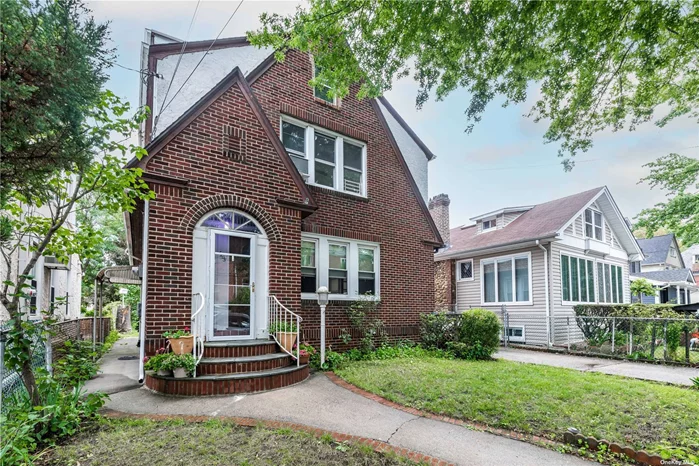 Ideally located brick and stucco detached 2 family Tudor in Bayside. Excellent condition. First floor: Living room, kitchen, separate dining area, 2 spacious bedrooms, renovated bathroom. Second floor: living room, renovated kitchen, separate dining area, 2 spacious bedrooms, cedar closet, renovated bathroom. Second floor is duplexed with staircase to full finished attic with 2 rooms, washer/dryer, storage space, windows/skylights. Finished basement with outside entrance has 2 rooms, bar area, separate utility room, storage space. 40 x 100 lot, long private driveway, 2 car detached garage, spacious private yard with high producing heritage grape vines (on new arbor), fig and sugar plum trees. Three blocks to Bell Boulevard&rsquo;s sought after restaurants and shopping. Few block to LIRR station. Near schools, community college, parks, bike paths, Little Neck Bay, Bayside Marina and Oakland Lake.