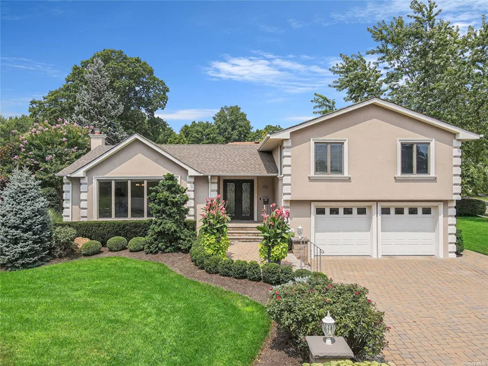 Prominent, renovated split level corner prop. in highly-sought after Herricks school district. Exterior of home sets the tone for the beauty you&rsquo;ll experience the moment you cross the threshold. Home flaunts hw floors, CAC, vaulted ceilings, recessed lighting, skylights, electric blinds & ample storage. Eat-in kitchen is bright, airy & ideal for the family chef. Master bed. w/ W-I closet can house a king-size bed & boasts master bath. Den is perfect for cozy nights around the wood-burning fireplace. W/ glass sliders that seamlessly segue to the backyard, you can opt for snuggling by the firepit shrouded in privacy instead. Complete w/ abundant storage, lower level of home can become whatever you dream: guest room, kids&rsquo; playroom, gym, office space, etc. W/ all amenities, houses of worship, restaurants, LIRR & hwy close, the only thing the new owner needs to bring to this home is pure excitement of owning one of the best homes this neighborhood has to offer!