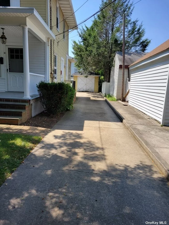 1 Bedroom Apartment in House with New Eat-in Kitchen, New Bathroom, Basement, 1 Car Garage, 1 Spot in Shared Driveway, Beautiful Front Porch, and Use of Backyard.