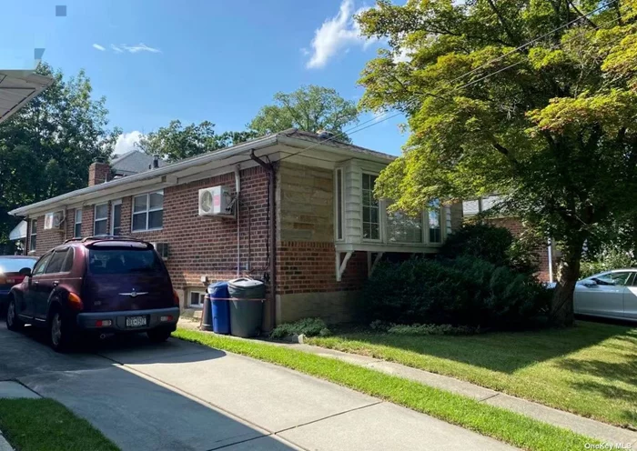 Extra Large Single Family Home: Beautiful Condition, ready for move-in. 3 Bedrooms And Two Full Bath. Finished Basement With Separate Entrance, Big Backyard. Parking Garage. Convenient To Bus Q13 & Q31. 26 School District! Lot: 41.17x100 Building Size: 26x50. LIRR conveniently few blocks away; close proximity to shopping center, bank, restaurants; minutes away from Little Bay Park