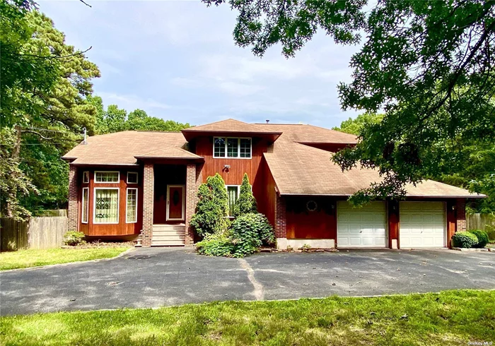 PRICE CUT NEAR $50000!!! A special, custom-designed, large contemporary 4 bedrooms 3.5 bath single family house, with hardwood floors & a high ceiling. The front of the house has a tree Island to ensure privacy and a circular driveway. Close to shopping, Long Island Railroad, Stony Brook University, and just a short drive to I-495.  1st Fl: Living Room with Fireplace, Dinning Room, Master Bedroom with Full Bath, Separate Shower & Jacuzzi; Office, Eating Kitchen, Half Bath, Laundry Room, Attached 2.5 Car Garage.  2nd Fl: Family Room, Three Bedrooms and Full Bath, Walk-In Closet.  Basement: Fully Finished! Family Room, 4 Rooms, Full Bath, Separate Entrance.  Huge Back Yard: Large Deck, storage shed, sitting area with stone table and bench.