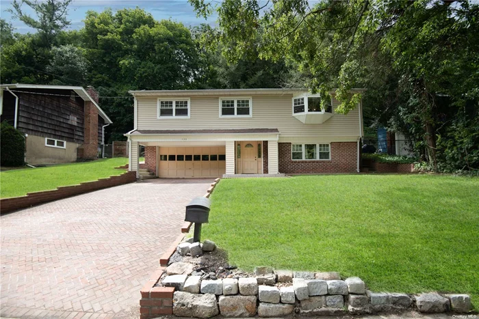 Welcome to this 2 Car Garage Updated Raised Ranch, All Tile Floor on the 1st Level, Foyer, Den W Fireplace (possible 4th bedroom), Finished Recreation and Laundry room, Hardwood Floors Throughout the 2nd Level, 3 Bedrooms W Jack And Jill Bathroom, Spacious Living and Dining rooms, Updated Kitchen and Bath,  Kitchen Door Leads Into A Large Screened In Enclosed Porch, Perfect for relaxing and entertaining.