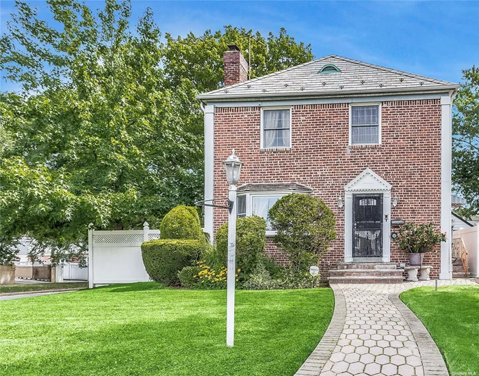 This picture-perfect Brick Colonial is located in the prestigious neighborhood of Bayside Hills. Hardwood floors usher us into the Living Room with the eye-catching fireplace which is also enjoyed by the formal Dining Room. The well-designed chef&rsquo;s kitchen with top of the line appliances extends to a green room or summer den. Upstairs are three generously sized bedrooms and a bath. The lower level displays the same craftmanship throughout the home with ample storage, laundry, playroom, and office. This beautifully poised corner residence, set on a 4000 sqft lot, boasts an attractive exterior with paved walkways, driveway leading to garage and charismatic yard. Conveniently located to highway, shopping and, school.