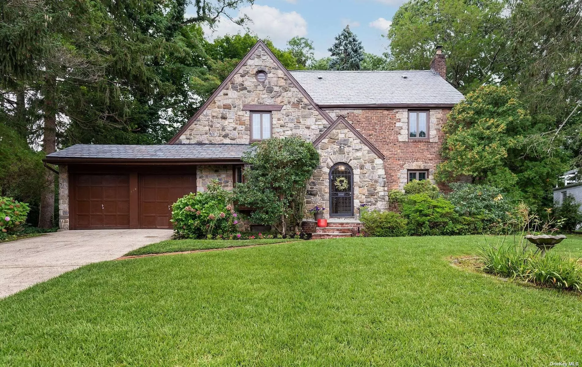 Lovely Brick Tudor Style Home in the Heart of Strathmore Vanderbilt. Easy-Living Layout Featuring Formal Living Room with Fireplace, Formal Dining Room, Kitchen, Pantry, Main Level Bedroom and Adjacent Full Bath with Step in Shower. The Second Level Hosts Two Additional Bedrooms (One with Over Garage Walkout), Full Bath, Plus Primary Bedroom with EnSuite Bath and Walkin Closet Within. Nicely Positioned on a 65 x 114&rsquo; Lot the Expansive Backyard has a Bluestone Walkway,  Patio and Plenty of Room for Outdoor Enjoyment. Centrally Located Close to Restaurants, Shopping, LIRR, Parks, Schools, Highways and Golf Courses.