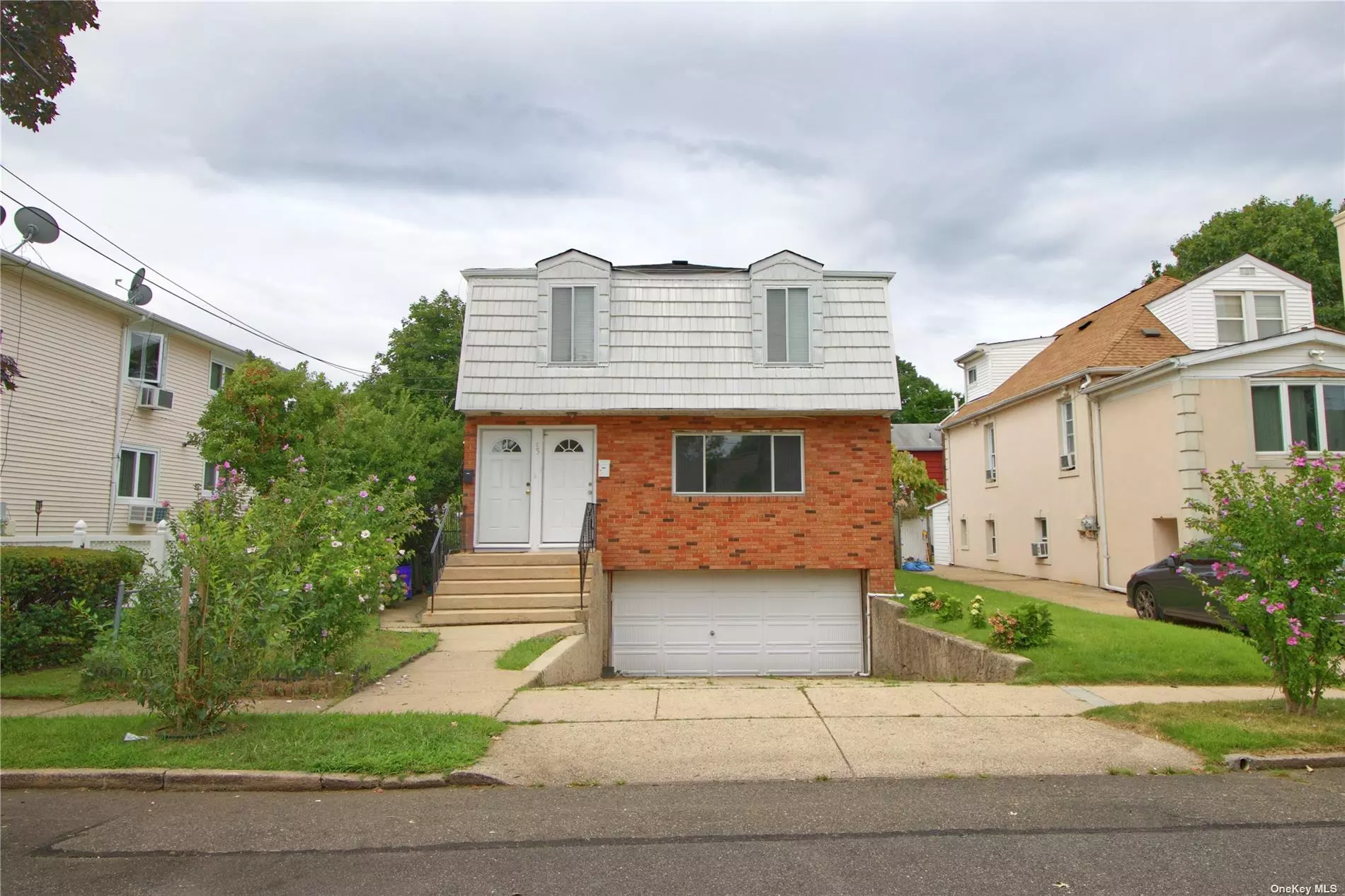 2 Family home in Manorhaven with new gas heating & new roof. Both apartments freshly painted & floors redone. Upstairs has renovated Kitchen. Move in condition Mid Block location. Close to All! 2 Car Garage