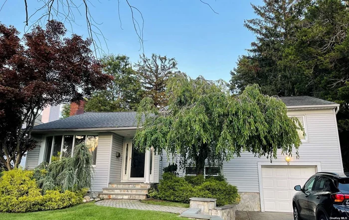 Beautifully Updated Split 3-Bedrooms 2.5-Bath with Expanded Modern Kitchen with Skylights and Radiant Heat. Programmed Underground Sprinkler System, 2100 Sq. Ft. Luxury Living Space. Central AC, Updated Appliances, Wall Of Closets, Perfectly Located on Lovely Street. Syosset School.