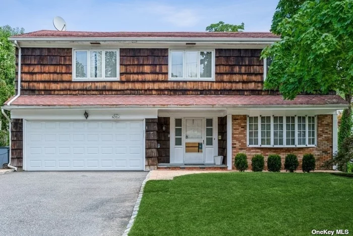 Move Right Into This Stunning Colonial, Located in the Heart of Great Neck. This Beautiful Home Offers a Gracious Living Room and Formal Dining Room. The Lovely Eat-in Kitchen Boasts Stainless Steel Appliances and Granite Countertops, it Also Offers Ample Space for Prepping and Serving. Enjoy Gatherings with Family and Friends in the Sunlit Family Room, Featuring Soaring Celings, Wood Burning Fireplace and Skylights. The Home also Features Five Bedrooms Including a Master En-suite, 2.5 Baths, Full and Finished Basement. Relax Peacefully in a Light-Soaked Sunroom, permitting Abundant Daylight, Equipped with Ductless Split Allowing You to Enjoy the Beauty of The Four Seasons While Sheltered Comfortably Inside. Other Features; Hardwood Floors, New Roof, New Furnace and so much more!