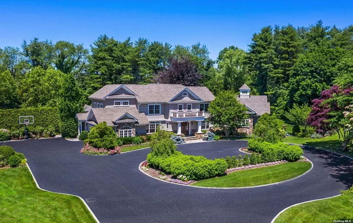 Incredible curb appeal awaits as you drive up the circular driveway to this renovated and expanded 5 bdrm, 5.5 bath home on a spectacular 2.33 private acres! The sprawling first floor w/pristine wood floors , offers a desirable open floor plan featuring great room w/double story ceiling, gorgeous stone gas fireplace, rear wall of windows/doors, custom built bookshelves, elegant formal dining room , cozy den and expanded chef&rsquo;s kitchen. Beautiful large breakfast room overlooks the manicured and very special backyard. The primary bedroom on the main level will not disappoint with two large fabulous closets, gas fireplace place and luxurious bath (radiant heat). Lower level with high ceilings has a large playroom, fabulous gym, bedroom with egress window , bath and storage! This smart home is set up for today&rsquo;s discerning buyer. has five star resort amenities which include heated Gunite pool and spa, outdoor covered kitchen and A/V entertainment, water and fire features.