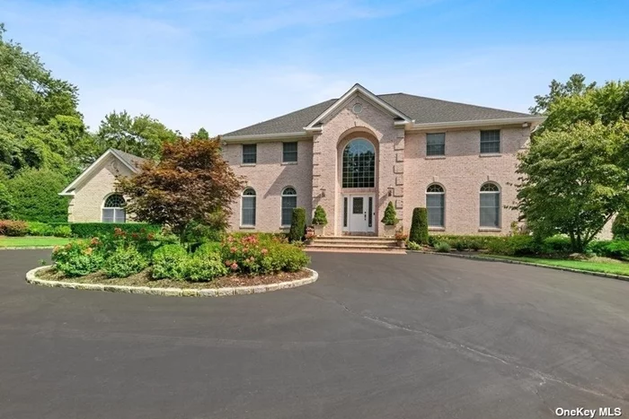 This beautiful brick Center Hall Colonial, with 5 bedrooms, 4 ? baths and a 3 car garage, sits on 2+ very private acres on a cul-de-sac in the Incorporated Village of Oyster Bay Cove. The 2 story entrance foyer leads you in to this spacious 5, 000 plus square foot home. The main floor offers many areas to relax, dine and entertain. The beautiful new kitchen is equipped with some of the finest stainless steel appliances and has plenty of beautiful Quartz counter space. The formal living room offers a spacious area for entertaining and the two dens both have beautiful stone wood burning/gas fireplaces. The upper level has a luxurious main suite and 3 additional bedrooms with en-suites. You will obviously notice as you walk through the entire house how meticulously maintained it is. The beautifully landscaped yard will draw you outdoors to have coffee on the veranda, swim in the in-ground pool, cook at the outdoor built-in bar-be-que counter, dine on the patio or just relax.