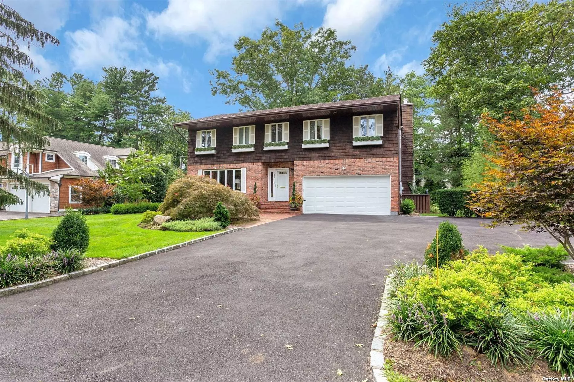 First Time on the Market, Perfectly Appointed Brick and Cedar Colonial, Nestled Amidst Beautiful Homes on a Tree Lined Street Mid-Block Location. The Home Features, Living room with French Doors and Oak Hardwood Floors, Natural Sun Light fills this Room, Formal Dining room with Oak Hardwood Floors, Powder Room, 3 Year old Eat in Kitchen with Custom Cabinetry and Marble Counter Tops Plus 3 Year old Stainless Steel Appliances, Den with Fireplace and Sliding Doors to the Cedar Deck, Great for Al-Fresco Dining, Spacious Master Suite with Custom Walk in Closets and Custom Built- ins, 5 Bedrooms, 4 Full Baths and 2 half Baths,  2 Car Garage, The Rear Property is Adorned with flowers and Privacy Trees. Close Proximity to the Enviable East Hills Pool and Tennis Park Community. Low Taxes. $22, 250.00, Roslyn School District.