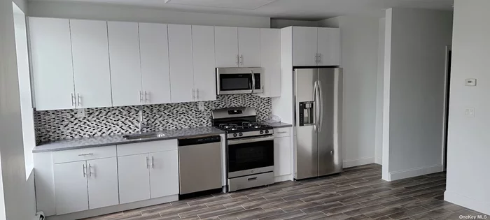 Spacious 4 Bedroom Apartment For Rent. This Renovated Apartment Features Beautiful Floors, Combo Kitchen with Stainless Steel Appliances, Lots of Natural Light , Lots of Windows. Steps Away From Shopping, Public Transportation, and Amenities.