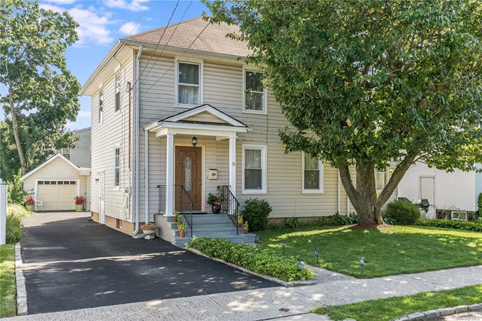 Beautifully renovated Side Hall Colonial with wood burning fireplace, eat-in-kitchen, hardwood floors throughout, updated baths, full basement with side entrance. Charming fenced backyard with beautiful landscaping. Private driveway. Prestigious Roslyn School District