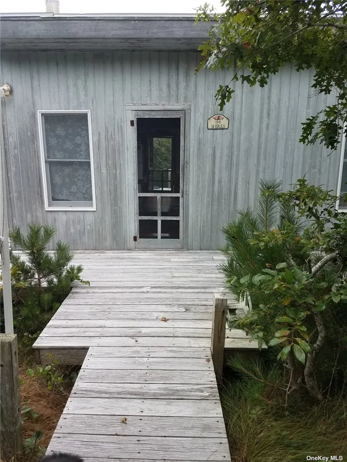 THIS COTTAGE IS IN BLUE POINT BEACH, 1 MILE WEST OF DAVIS PARK. THERE ARE ONLY 8 HOUSES THERE SO IT IS QUITE AND PRIVATE. THE COTTAGE IS OVERLOOKING THE BAY, GREAT SUNSETS. THERE IS A DOCK FOR A BOAT. A PRIVATE WALK-WAY TO THE OCEAN WHERE YOU CAN WALK FOR MILES AND NOT SEE ANYONE.....ITS A VERY SPECIAL LOCATION!