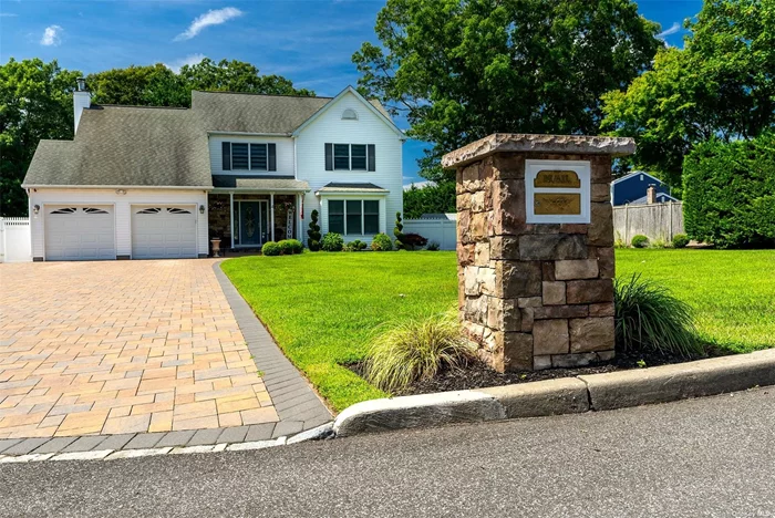 Entertainer&rsquo;s Delight!! Come See This Beautiful 4 BR, 3.5 Bath Home on a Cul De Sac in The Desirable Neighborhood of E. Patchogue. This Incredible Home Has An Impressive Entryway With Vaulted Ceilings And Skylights. Large Bedrooms Including a Master Ensuite With Huge Walk-in Closets. Formal Dining As Well As Formal Living Room, Including Gorgeous EIK with Granite Counter Tops/Island with SS Appliances As Well As A Family Room. New Anderson Sliding Door to the Backyard Which is Paradise for Any Entertainer. Walk Out To A Trex Deck With An Upscale Resort Feel. In-Ground Swimming Pool With A Waterfall and Pavers, Themed Tiki Wet Bar Which Includes 6 Bar Stools And Fridge, Elegant Fire Pit and Paver Seating Area. Look Out Back To Protected Wetlands, Where No Homes Can be Built. This is a Magnificent Home That Will Not Last, Come And See For Yourself!!