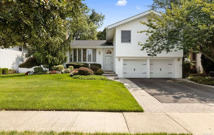 True pride of ownership, drive up this beautifully manicured Hollywood split in the F section of East Birchwood. Hardwood floors, vaulted ceilings, and plenty of windows makes this home shine light and bright. Eat in kitchen with double Thermador ovens, side by side fridge, and newer Bosch dishwasher with sliders to Trex deck. Expanded family room with gas fireplace and sliders to outdoor patio. Upstairs features master bedroom with master bath, plus two additional bedrooms, and a full bath. Finished lower level that is great for den, playroom, or gym. Two car garage.