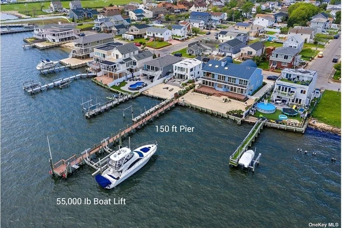Builders Custom Waterfront Dream A Yachtsman Paradise, 180 degrees views Walk out on your 150-foot custom Pier Longest pier on Long Island for Sunsets or enter your Yacht on a 55, 000Lb lift that can accommodate a 60-foot Yacht. See the Captree Bridge, Fire Island lighthouse from anywhere in the House. The First Floor has over 50 Glass Capturing views of Great South Bay.