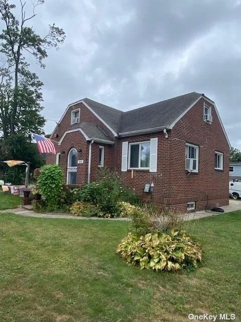 Lovely Solid Brick Cape Cod. Close To Great Shopping And Restaurant. Just Down The Block From New York Institute Of Technology. Full Basement, Gas Heat, Hardwood Floors, Fireplace In Living Room.
