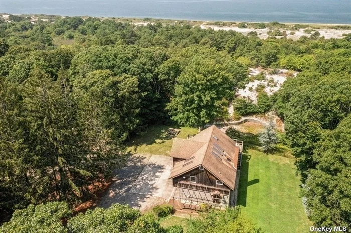 Spectacular Waterfront Oasis Located In Peconic Dunes. Features 9+ Acres Of Lush Woodland. Overlooking LI Sound, With 250 Feet Of Sandy Beach For Swimming And Fishing. Incredible Sunset, Nature Trail Amongst Blueberry, Cranberry & Beach Plums. Osprey Platform In Dunes, Achery Hunting, And Much More. Existing Structure On Property Is Sold As Is And The Perfect Spot To Build Your Dream Home.