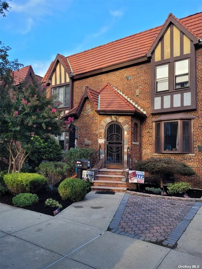 This Beautiful Semi-Detached Brick Tudor in the Heart of Bayside Features Spacious, Bright and Open Living Room w/Bay Window & 2 Stained Glass Windows, Formal Dining Room, Large Eat-In-Kitchen w/Walk In Pantry, Stainless Steel Appliances, Granite Counter Tops, 1/2 Bath and Back Door to Yard. Go the 2nd Floor Where You have Natural Light Coming in from the Beautiful Stained Glass Skylight, 3 Spacious Bedrooms and 1 Full Bathroom Completely Renovated in 2013. The Basement Also renovated in 2013 Features a Family Room, Bedroom or Office, 1/2 Bathroom, Walk-In-Closet, Laundry Room and Separate Access to the Back Yard w/Above Ground Pool. Wood Floors and Cathedral Ceilings Throughout. Shared Driveway. 1 Car Detached Garage. Conveniently Located to the Bayside LIRR Station, Buses Q12, Q13, Q27, Q31,  Express Bus to Manhattan, N21 to Nassau, All Major Highways, Bell Blvd w/Great Dining & Shopping, Schools, Parks and Houses of Worship.