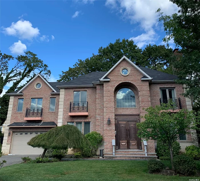 Great Neck South School. Lake Success Stately Brick Colonial Custom Built In 2011 on . 2 Story High Ceiling Entry Foyer. Open Layout, Lr w/FP, Dinning Area, Kitchen w/Island, designated area to cook. 1st fl Bedroom, 1 Full Bath, French Door To Backyard. Installed gas generator and 2 Car Garage. 2nd fl 9 feet high has a huge Master bedroom w/fire place, WIC, full body shower, jacuzzi and balcony. 3 additional bedrooms and 1 full bath, 2 balconies. 4 zoned Heating and CAC. The Lake Success Village offers 18 hole golf course, country club, summer camp, gym, pool, tennis courts, private police,