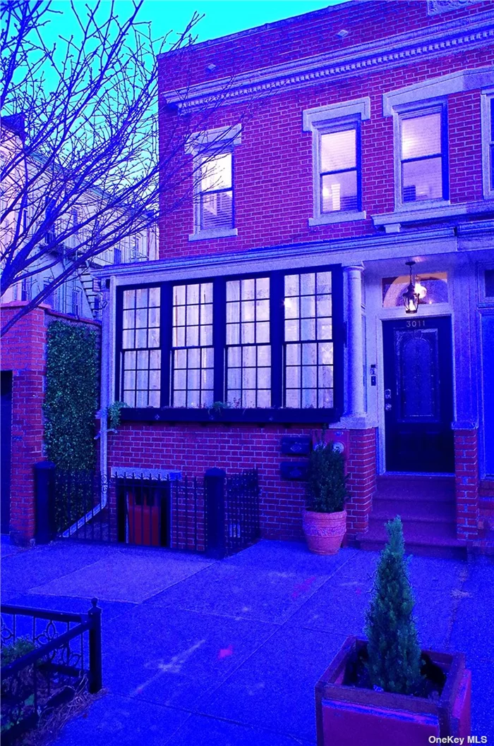 Astoria 4-bedroom 2-bath townhouse on tree-lined street (currently set up as legal 2-family duplex but convertible to a 1). Includes a backyard, wraparound deck, solar panels, detached garage, green roof over garage, two kitchens and mini split AC. Convenient location near park, shops, subway, etc. The 2nd floor is sun drenched and has two bedrooms, one of which includes a morning kitchen (perfect for a guest suite). You could also remove the kitchen and convert it to an extra BR. Additionally, there is a bedroom in the 1st floor, which can be used as an office/guest room, and a bonus room in the finished basement. The basement leads to private backyard. The living room is set up for Atmos speakers. Bonus features include smart technology (locks, thermostat, and lighting), gas steam boiler, hybrid hot water heater, Andersen windows in the sunroom, original brick wall, wood floors, rain showers, tree guard, etc.