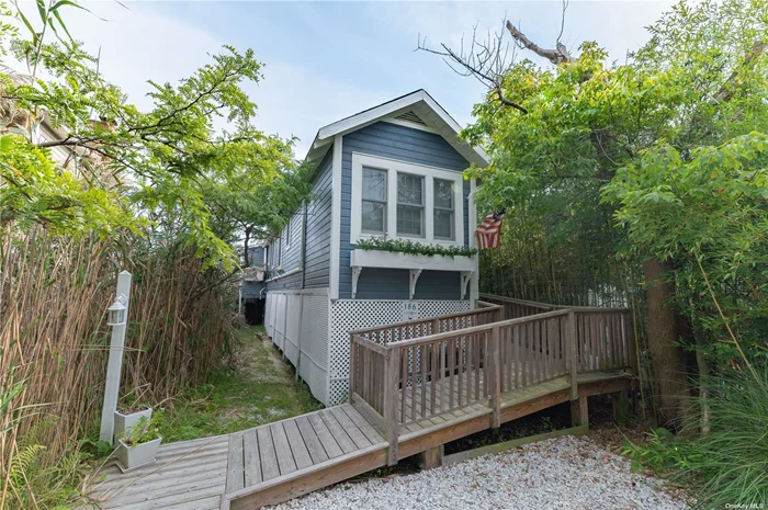 Adorable beach home with one bedroom & one & 1/2 baths has potential for more bedrooms, back deck for entertaining. Fully renovated & raised. Total Turn Key!