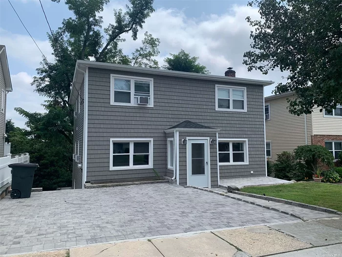 Beautifully renovated 1st floor apartment with hardwood flooring throughout. First floor offers 2 bedrooms, full bath and living room/dining area and kitchen. Lower level features a spacious bedroom, full bath, playroom, laundry and outside entrance.