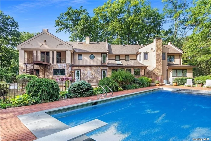 This Magnificent Colonial Sits High On A Grand Front Lawn On Over 2 Acres Of Manicured Tree-Lined Property At The End Of A Private Cul-de-sac. The Home Boasts A Stunning Stone & Masonry Exterior, 5 Car Garage, & Multiple Balconies Overlooking A Secluded & Serene Backyard. The 2-story Foyer Opens To A Formal Living Room & Dining Room Adjacent To A Large Den w/ A Wood Burning Fireplace. Almost 7000 Sq. Ft. Of Living Space, The Home Features An Expanded Gourmet Kitchen, Custom Italian Cabinets, Expansive Island, & Peripheral Views Of The Backyard Oasis. The 1st Floor Includes Separate Guest Living Quarters. The 2nd Level Features 5 Bedrooms & 3 Full Baths. The Primary Suite Epitomizes The Ultimate In Luxury Living w/ Cathedral Ceilings, 5 Walk-In Closets, & French Doors Leading To A Covered Balcony Overlooking A Resort Like Yard. Spiral Stairs Lead To A Two-tiered Patio Featuring A Large Pool & Separate Wading Pool. Laurel Hollow Beach Rights.