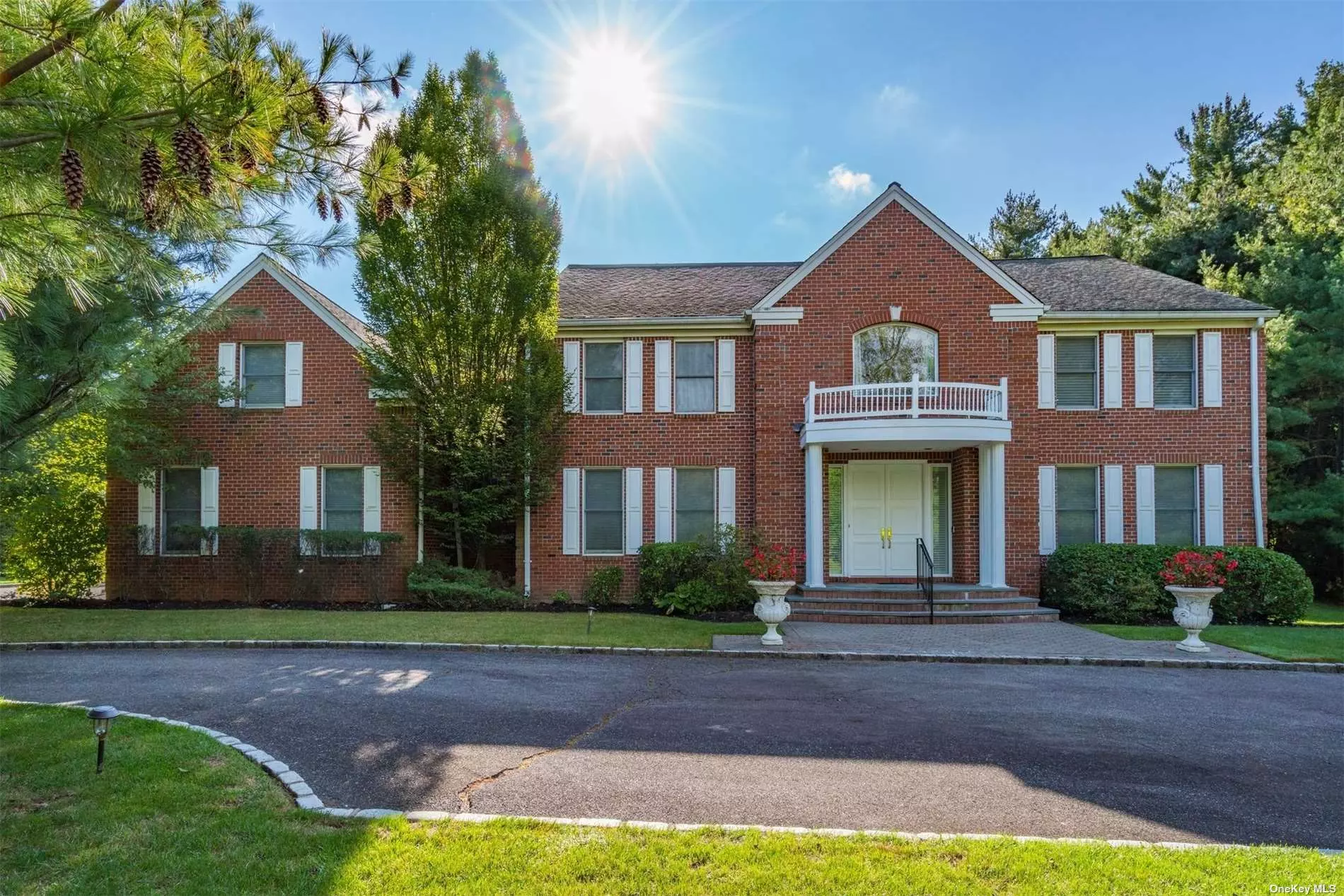 Celebrate the coming Holidays in your new home! Impeccably maintained Brick/Frame, Muttontown colonial on three manicured acres with sweeping two-story entrance, high ceilings, quality details & hardwood floors throughout. Formal living room is adjacent to large den with custom built in cabinetry & fireplace, a huge kitchen with custom white cabinetry, granite (Absolut) countertops, Thre is a large pantry, guest/maids rm. w/bath - perfect space for private office. Laundry room also with access to yard completes the first floor. The generously sized master suite with tray ceiling provides a sitting area, two walk-in-closets & spa bath. There are three additional bedrooms, two full baths and a large bonus room with walk-in cedar closet. Endless possibilities for use of space. Convenient to major roads, downtown, fine dining, and The Americana Mall. Come and enjoy the beaches, sunsets, fresh air - the quality of life that the North Shore of Long Island has to offer A Must see!