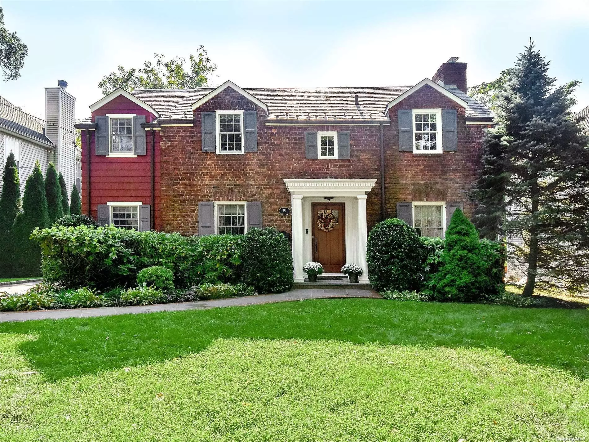 Beautiful and updated 4 Bedroom/2.5 Bathroom Colonial on a tree lined street in Manhasset Bay Estates. The first floor of this inviting home has an entry foyer, large living room with fireplace and French doors that lead to a patio with an outdoor kitchen, formal dining room with a second set of French doors leading to the garden, large eat-in, updated kitchen with new pantry, cabinets, wine refrigerator, mudroom & powder room. The second floor has a large Master bedroom with Master bathroom, closets and window seat that overlooks the back garden, 3 additional bedrooms and bathroom. Full basement with wood burning fireplace, whole house water filtration/reverse osmosis system, and air purifier. Additional features of this sun-drenched home include CAC, hardwood floors throughout, surround sound, alarm, in-ground sprinklers. Perfectly located across the street from Merriman Park, walk to town, close to LIRR. Private beach and mooring rights with fee. You do not want to miss this one!