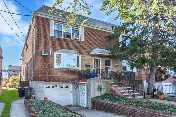 Clean & Well Maintained 2 Story 2 Family Home in Prime Bayside Location, Close to Bell Blvd-Shopping, Restaurants, Buses, LIRR Woodfloors under carpet throughout, 1 Car Attached Garage, full partial finished Basement .