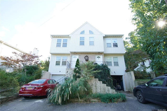 Spacious Duplex, total of 6 bedrooms and 4 baths and two half baths, 2 Fireplace, Full Basement with one car garage. Overlooking the Glen Cove Marina/ separate entrance to each unit. all utility are separated. each unit has full basement and garage parking