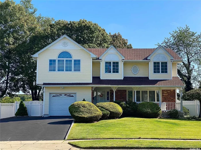 Meticulously maintained 4 Bedroom/ 2.5 bath Colonial in well-sought after Smithtown School District. This home boasts beautiful wood floors, an open floor plan, and plenty of natural light. Entire 1st floor was redone in 2015 including the custom kitchen and half bath. Stainless steel appliances. Crown molding and custom trim throughout the entire home. Head on upstairs to the expanded 16x20 master bedroom, featuring a spacious master bathroom with jacuzzi tub, separate shower with glass shower door, double vanity, and his/hers walk-in cedar lined closet. Finished basement with hi-hats, ample storage, and room for home office. Automatic whole house Generac generator tied into natural gas. Andersen windows. Hot water heater and roof replaced in 2019. Pride of ownership- Must see, no expense spared in this home!