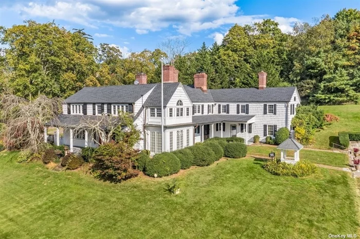 Amazing opportunity - 2 acre, 12, 000 sq ft estate in Upper Brookville. This unique estate features a 7, 500 sq ft main house with 6 bedrooms, 7 bathrooms, 5 fireplaces, beautiful wood floors, and kitchen and living room each with a fireplace and two sets of French Doors opening up to the patio and a salt water, heated in ground pool. The grounds also include a detached 3 car garage with a 2 bedroom apartment, a clubhouse with a fireplace, wet bar, and half bath, and a 2 bedroom guest cottage.
