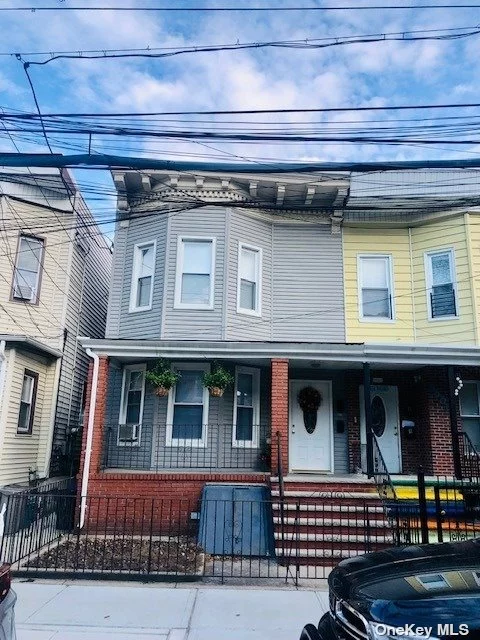 Lovely Semi Attached Legal 2 Family move in ready. New kitchens, and bathrooms.  Full Finished basement with ose, fenced yard. Call for appt. First floor and basement can be used as a duplex or sep. Steps from the J Train, 2 Blocks to Forest Park, 1 Block to shops and restaurants.