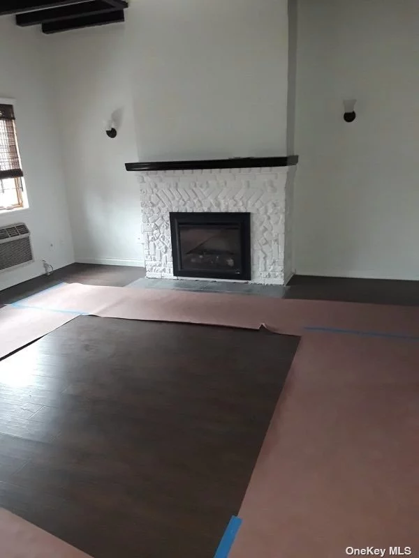 Renovated apartment on first floor. Living room, dining room, new kitchen, bedroom, new bathroom. Freshly painted. Refinished hardwood floors. Fireplace. Washer dryer in unit. Finished basement. Pets welcomed.