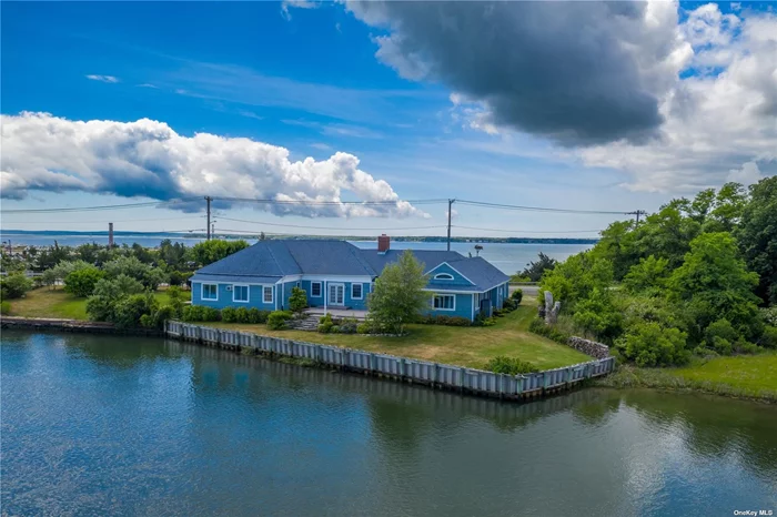 One Of A Kind Offering - Watch Sunrise & Sunset At This Unique Waterfront Nestled Perfectly Between Peconic Bay And Arshamomaque Pond. Recently Renovated. Sun-Drenched Home Features 4 Ensuite Bedrooms With All New Bathrooms. High Ceilings, Wood Floors, Oversized Living Room, Billiard Room, Outdoor Shower. Entertain Or Bird Watch On Private & Spacious Backyard Deck & Lawn Overlooking The Expanse Of Preserved Land, And Nature Walking Trails In The Nearby Estuary. Ideal For Kayaking, Paddle Boards, Small Crafts. CLose To All The Great Things We Love About The North Fork. Former Nautical Antique Store - Zoned Marine 2.
