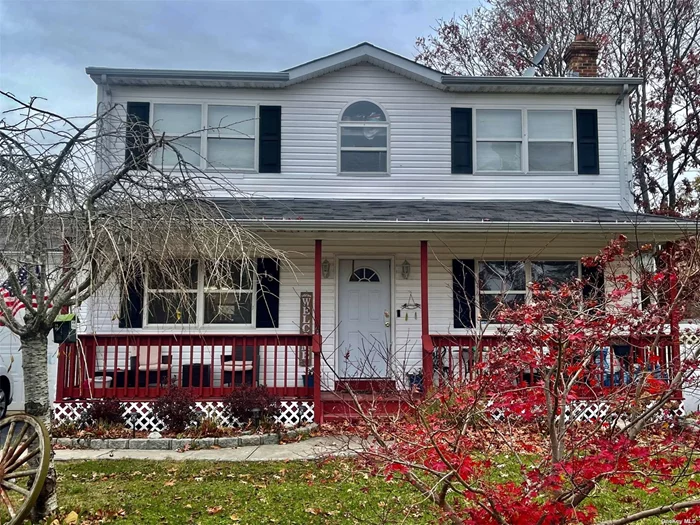 Must See -beautiful 3 bedroom Colonial with 2 full baths,  living room, dining room, EIK, with hardwood flooring throughout,  2 car garage, full basement, porch, deck and white vinyl fencing.  Belguim block, Close to the train station, Sunrise Highway and the Long Island Expressway and Smith Point Beach.