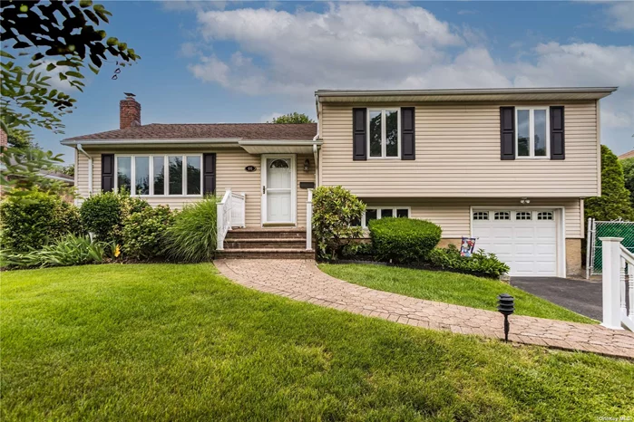 Don&rsquo;t Miss this 3/4 Bedroom Split Level in Syosset Groves! Beautiful Updated Kitchen with Granite Counters and Stainless Appliances, 2 1/2 New Bathrooms,  Oversized Yard,