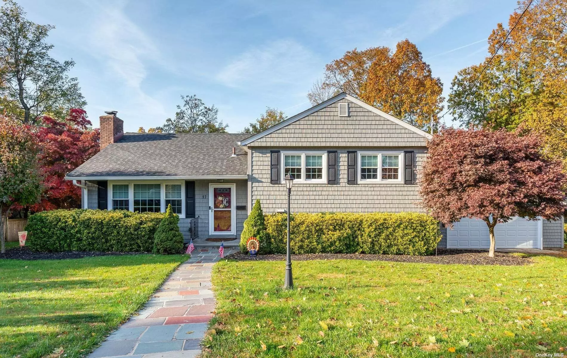 Meticulously updated Manhasset Bay Estates gem nestled in on a dead-end street - Close to Pine St. Park. 4-bedrooms, 3 full new baths. Living room w/gas fireplace, granite countertops & stainless appliances. 2-car garage. Beach & mooring rights w/dues.