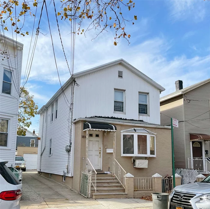 Legal 2 family house located in the heart of college point . This house features 1bd 1bth on first floor and 2bd 1bth on second floor ,  basement has 1 full bathroom with separate entrance , 2 car detached garage . Close to all shops, walk to bus station . Motivated seller . Must see !!!