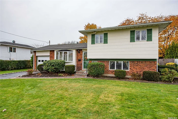 Well Maintained 4 Bedroom Split Level, Rear expansion boasts Formal Dining Room with pegged oak floors. Spacious Eat in Kitchen, Vaulted Ceiling in Living Room. Gas heat, central air, 5 zone inground sprinkler, enclosed screened in porch.